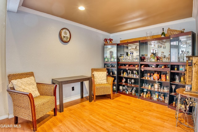 37214 Bunker Ct, Palmdale, CA 93550 - sitting room featuring a bar, wood finished floors, and ornamental molding