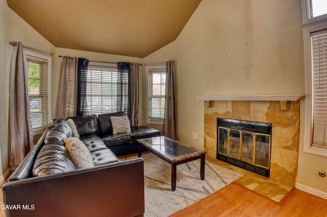 37214 Bunker Ct, Palmdale, CA 93550 - living room with vaulted ceiling, wood finished floors, and a fireplace