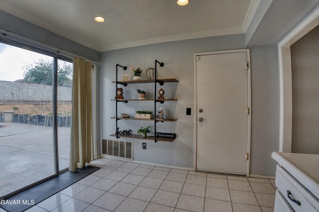 37214 Bunker Ct, Palmdale, CA 93550 - unfurnished dining area featuring crown molding, light tile patterned floors, a textured wall, and recessed lighting
