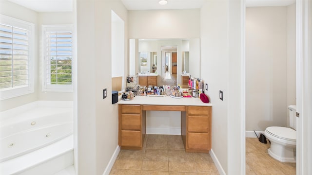 3929 Derby Cir, Quartz Hill, CA 93536 - bathroom featuring tile patterned flooring, vanity, a tub with jets, and toilet