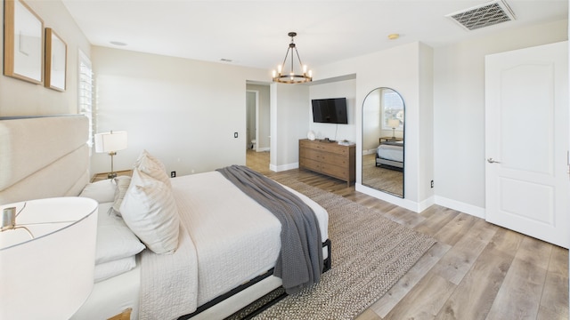 3929 Derby Cir, Quartz Hill, CA 93536 - bedroom with a chandelier, wood finished floors, and baseboards