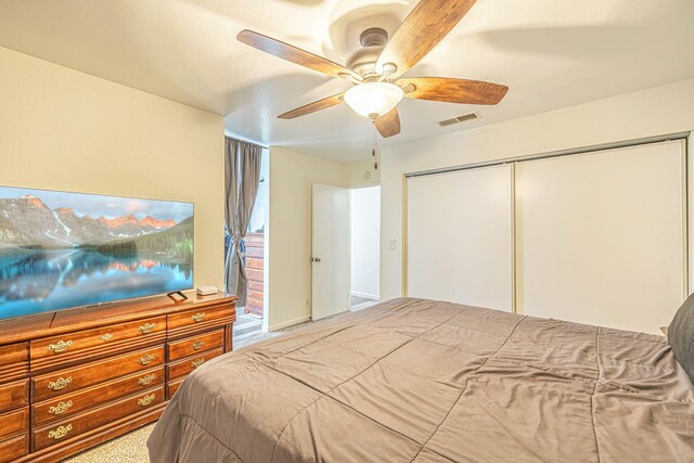 bedroom featuring visible vents, a closet, and ceiling fan