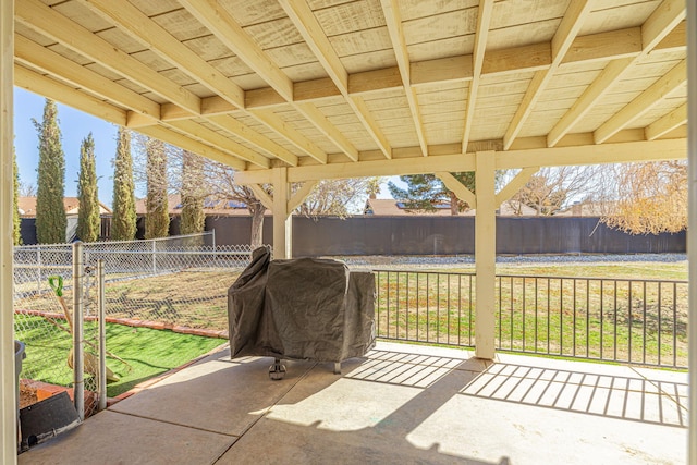 view of patio / terrace with grilling area and a fenced backyard