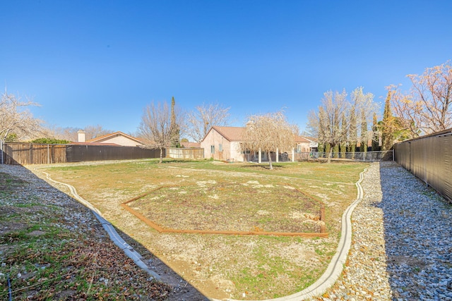 view of yard with a fenced backyard