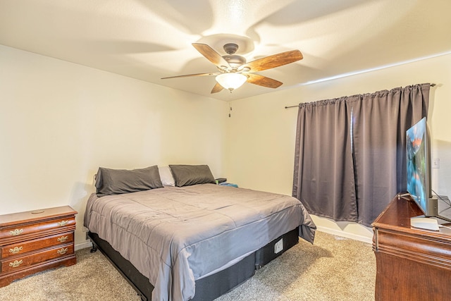 bedroom with ceiling fan and carpet