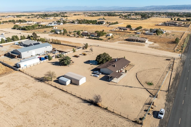 birds eye view of property featuring a mountain view and a rural view