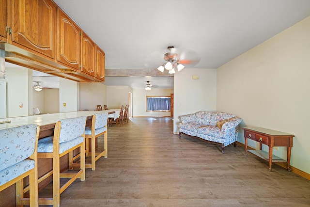 kitchen featuring ceiling fan and light hardwood / wood-style floors