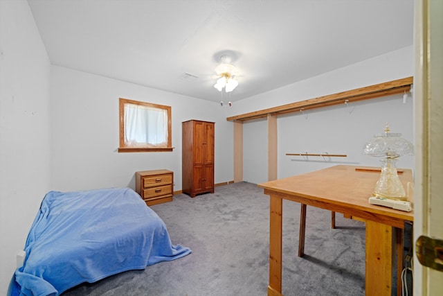 bedroom featuring ceiling fan and light colored carpet