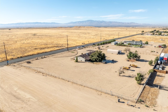 birds eye view of property featuring a mountain view and a rural view