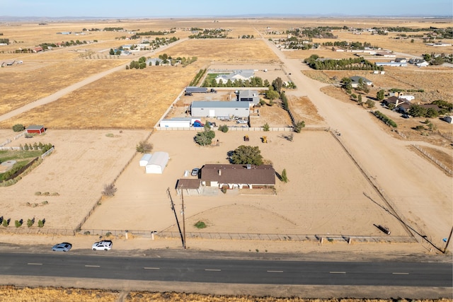 birds eye view of property with a rural view