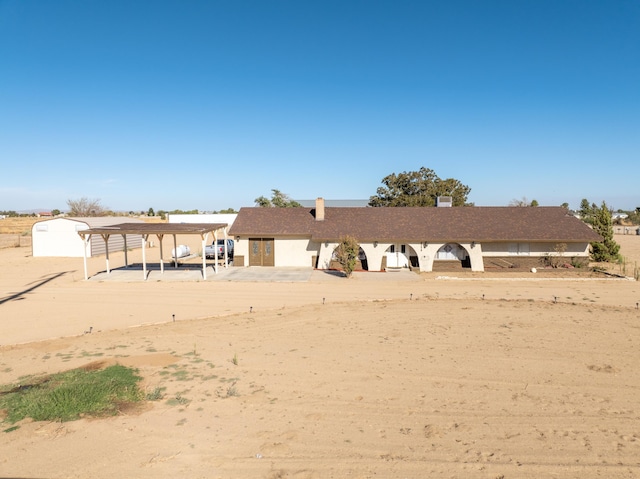 view of front of house with a carport