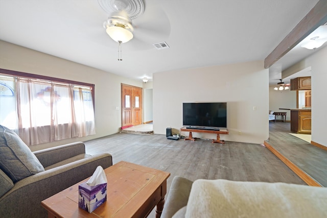 living room with ceiling fan and wood-type flooring