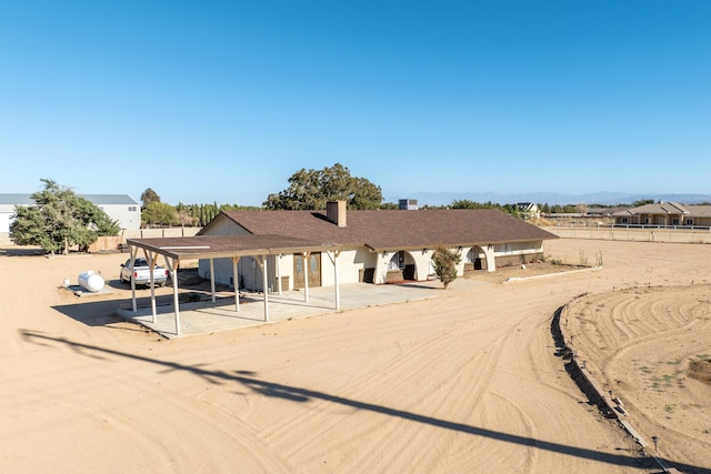 view of front of house with a carport