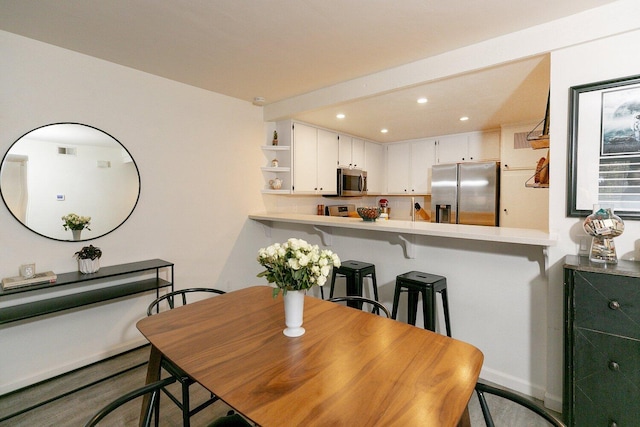 dining space featuring visible vents and recessed lighting