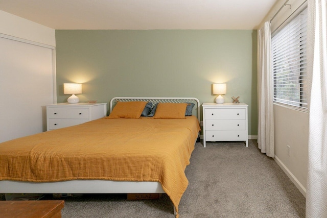 carpeted bedroom with baseboards