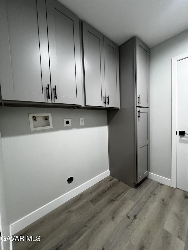 10165 E E Ave Unit S10, Littlerock, CA 93543 - laundry room featuring hookup for an electric dryer, cabinet space, wood finished floors, and washer hookup
