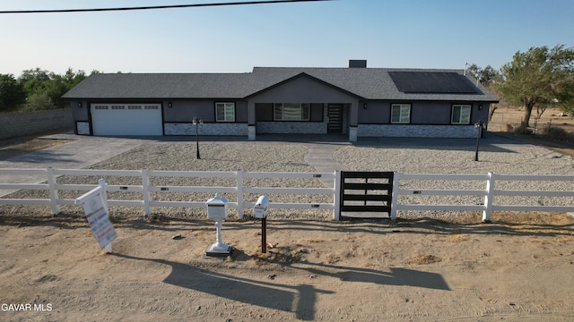 10165 E E Ave Unit S10, Littlerock, CA 93543 - ranch-style house featuring a fenced front yard, a garage, driveway, and stucco siding