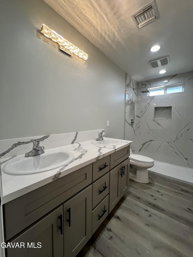 10165 E E Ave Unit S10, Littlerock, CA 93543 - full bath with double vanity, a marble finish shower, and wood finished floors