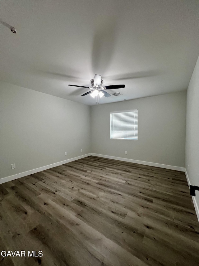 10165 E E Ave Unit S10, Littlerock, CA 93543 - empty room featuring dark wood-type flooring and ceiling fan