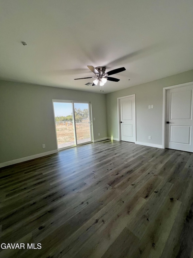 10165 E E Ave Unit S10, Littlerock, CA 93543 - unfurnished room featuring dark wood-style flooring and ceiling fan