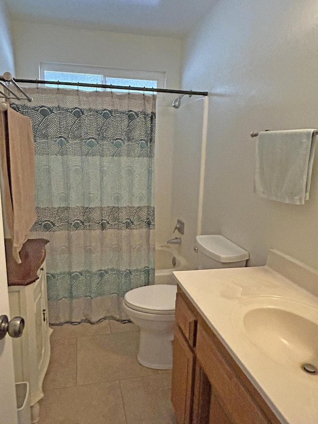 full bathroom featuring tile patterned floors, vanity, toilet, and shower / bath combo