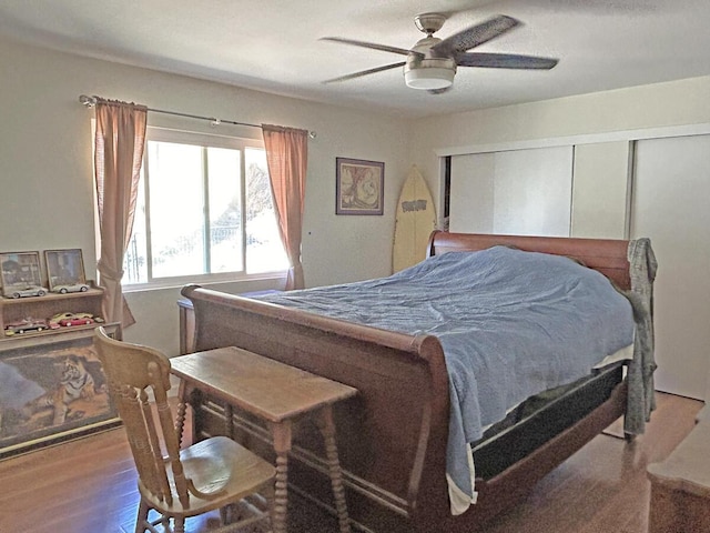 bedroom with ceiling fan and wood-type flooring