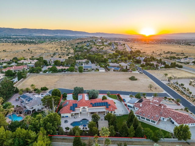 aerial view at dusk with a mountain view