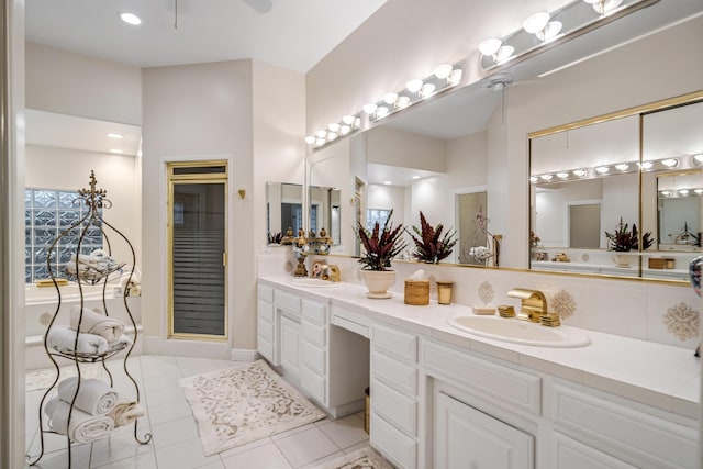 bathroom with tile patterned floors and vanity