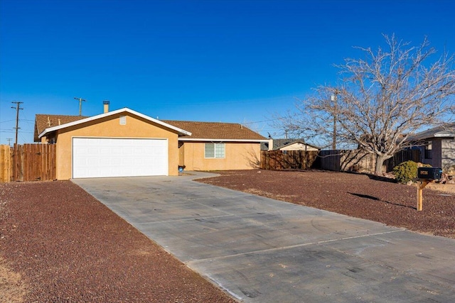 ranch-style home with concrete driveway, an attached garage, fence, and stucco siding