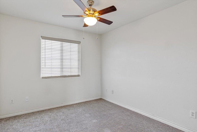 empty room featuring carpet floors, ceiling fan, and baseboards