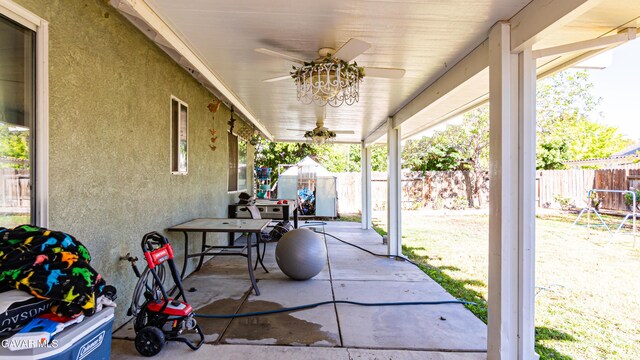 2839 Minford St, Lancaster, CA 93536 - fenced backyard with ceiling fan and a patio