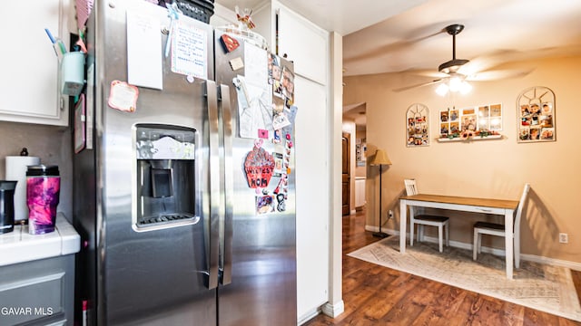 2839 Minford St, Lancaster, CA 93536 - kitchen with stainless steel fridge with ice dispenser, ceiling fan, dark wood finished floors, tile countertops, and white cabinets