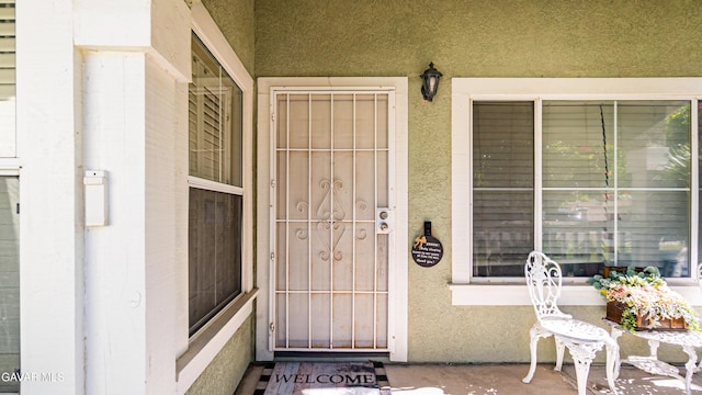2839 Minford St, Lancaster, CA 93536 - property entrance featuring covered porch and stucco siding
