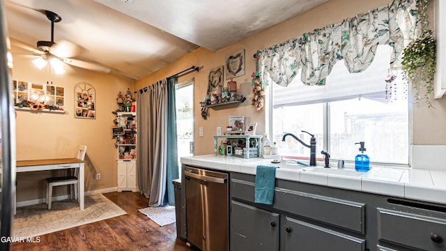2839 Minford St, Lancaster, CA 93536 - kitchen with dishwasher, dark wood-type flooring, tile countertops, lofted ceiling, and ceiling fan