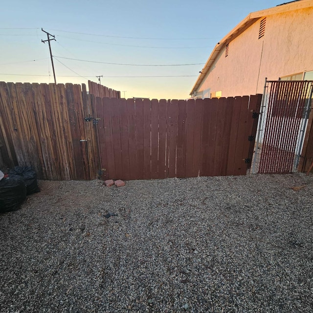 view of yard at dusk