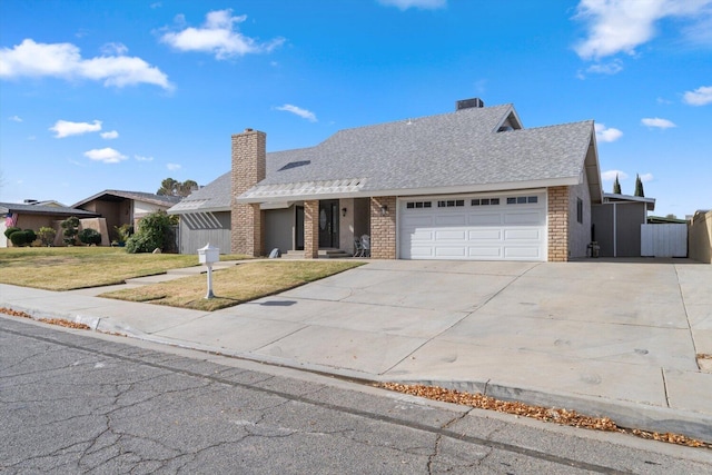 single story home with a front yard and a garage