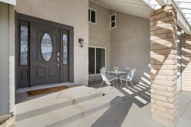 doorway to property featuring covered porch