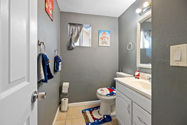 bathroom with tile patterned floors, vanity, and toilet