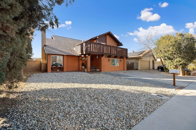 44627 E 11th St, Lancaster, CA 93535 - view of front of home with concrete driveway, roof with shingles, a garage, and a chimney