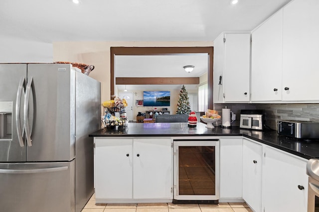 44627 E 11th St, Lancaster, CA 93535 - kitchen with stainless steel fridge, beverage cooler, dark countertops, white cabinets, and recessed lighting