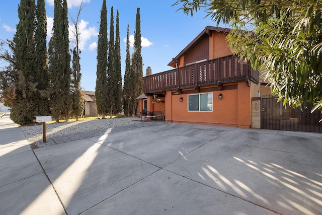 view of property exterior featuring a balcony