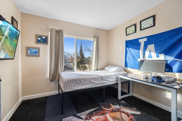 bedroom featuring a textured ceiling