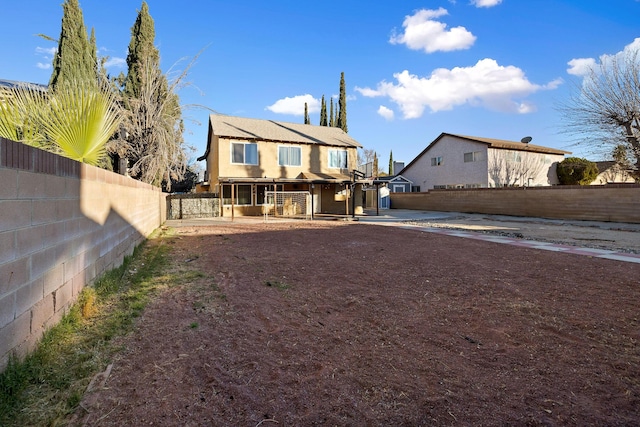 44627 E 11th St, Lancaster, CA 93535 - rear view of property with a fenced backyard, a patio, and stucco siding