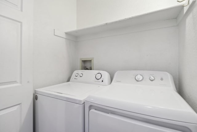 laundry area with washing machine and clothes dryer