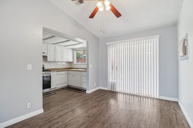 kitchen featuring dark wood-style flooring, white cabinets, a sink, dishwasher, and gas stove