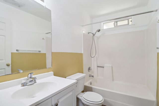 bathroom featuring toilet, visible vents, bathing tub / shower combination, and vanity