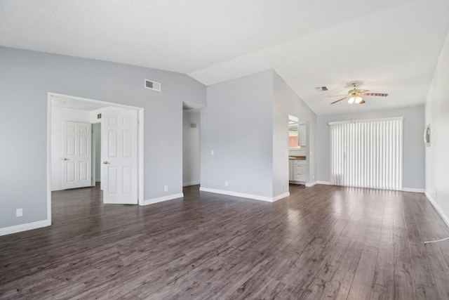unfurnished living room with visible vents, a ceiling fan, vaulted ceiling, and dark wood-style floors