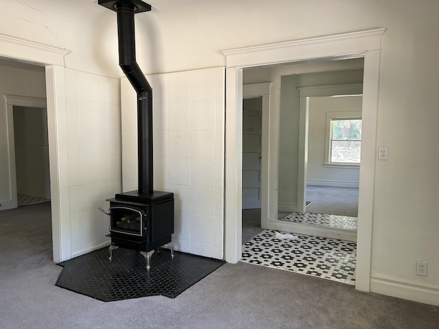 interior details with a wood stove and carpet