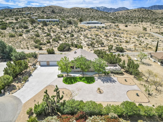 bird's eye view with view of desert and a mountain view