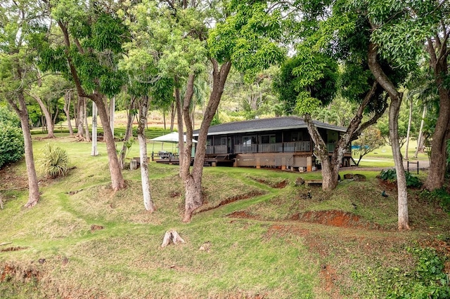 6281 Hauaala Rd Unit 2, Kapaa, HI 96746 - view of front facade with a deck and a front lawn